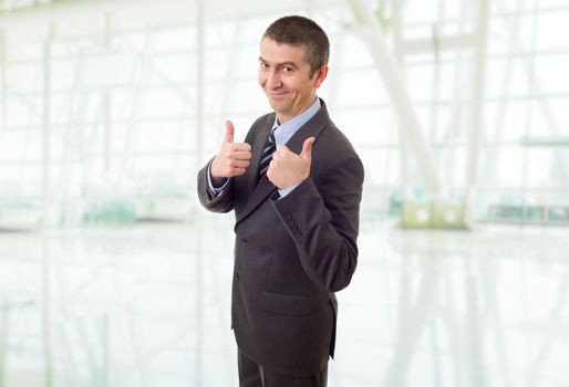 happy business man going thumb up, at the office