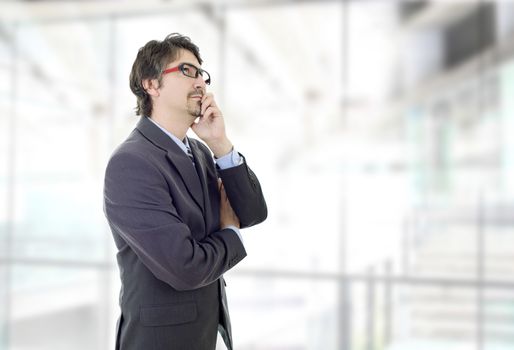 young business man thinking, at the office