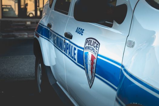 Agde, France - January 1, 2019: closeup on a car of the municipal police of Agde on a winter day parked in the city center