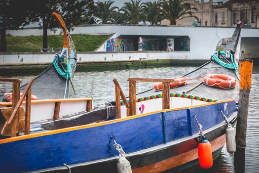 Aveiro, Portugal - May 7, 2018: view at the dock of the famous Moliceiros, traditional boats that used to harvest algae once and now transport tourists to the city canals