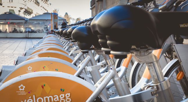 Montpellier, France - January 2, 2019: Velomagg bike sharing city bikes for rental in Montpellier. Bike sharing is a popular city transport