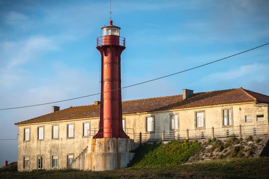 Esposende, Portugal - May 8, 2018: Architectural detail of the Esposende lighthouse near Sao Joao Baptista Fort by the sea on a spring day