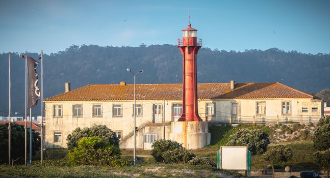 Esposende, Portugal - May 8, 2018: Architectural detail of the Esposende lighthouse near Sao Joao Baptista Fort by the sea on a spring day