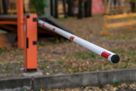 Automatic electric barrier at the entrance to the yard close-up