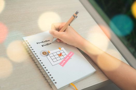 Woman hand using notebook do planning with calendar icon for manage work and life plan. Work from home or anywhere concept.