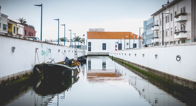 Aveiro, Portugal - May 7, 2018: Small boat docked on a canal in the city on a spring day