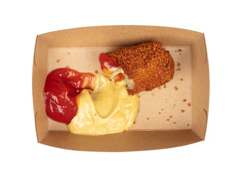 Partly eaten brown crusty dutch kroket with mustard and ketchup isolated on a white background