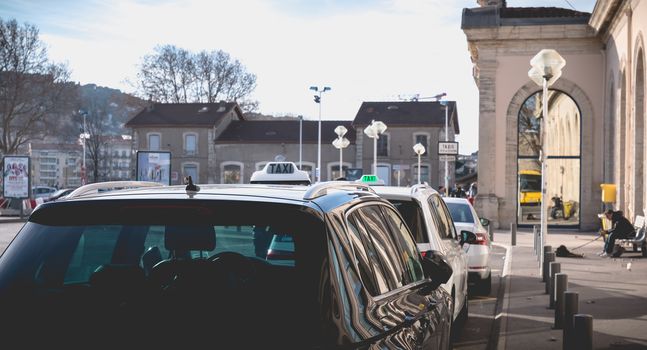 Sete, France - January 4, 2019: Taxi line in front of the train station in the city center on a winter day