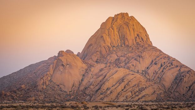 The Spitzkoppe mountain at sunrise in Namibia in Africa.