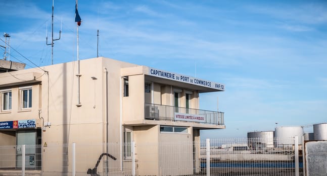 Sete, France - January 4, 2019: Architectural detail of the captaincy of the commercial port on a dock on a winter day