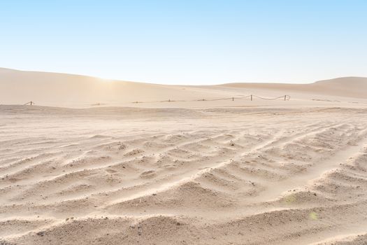 Desert dunes of the Namib-Naukluft Nation Park at sunrise near Swakopmund in Namibia, Africa.