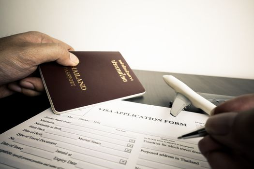 Tourist is filling a visa application form