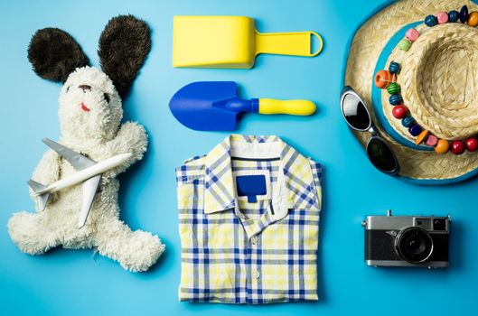 Kid fashion and beach accesories flatlay for Summer vacation theme