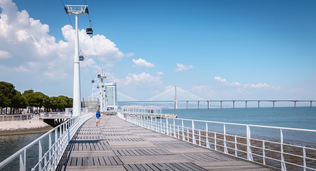 Lisbon, Portugal - May 7, 2018: Telecabine Lisboa at Park of Nations (Parque das Nacoes). Cable car in the modern district of Lisbon over the Tagus river on a spring day