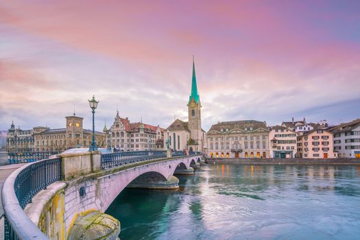 Cityscape of downtown Zurich in Switzerland during dramatic sunset.