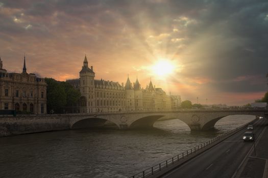 Romantic of Paris center city on the Seine river during the warm orange color sunset, France