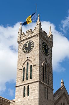 Parliament government clocktower with Barbadian flag is located on Broad Street in Bridgetown in Caribbean island Barbados