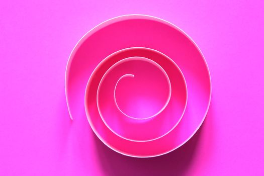 One purple spiral made from paper on pink background