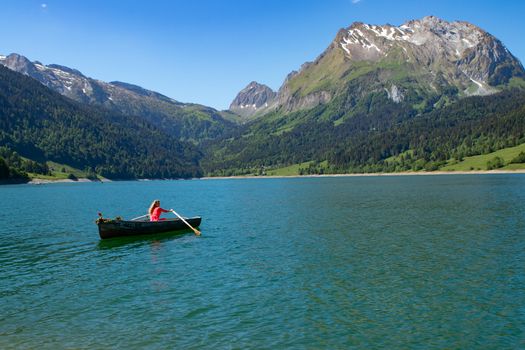 romantic scene with female model with long blond hair on a boat. Life style Shooting of a girl