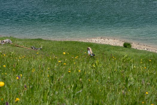 Life style woman with long blond hair on mountain bike in Swiss Alps