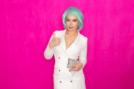 Beautiful young woman with menthol short hair in a white business jacket dress holding a silver small handbag