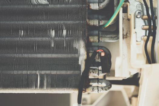 Worker to cleaning coil cooler of air conditioner by water for clean a dust on the wall in customer home when maintenance service