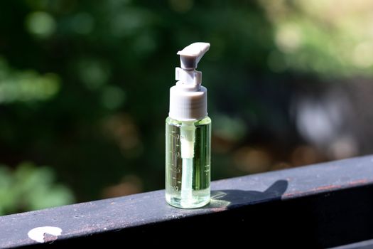 Hand sanitizer bottle on a windows sill
