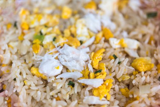 Crab meat fried rice is seafood for sale at Thai street food market or restaurant in Bangkok Thailand