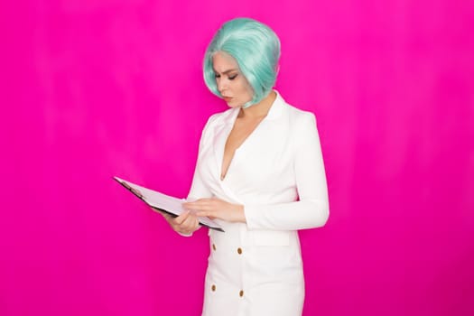 Beautiful young woman with short blue hair in a white business dress jacket holding a black folder with documents