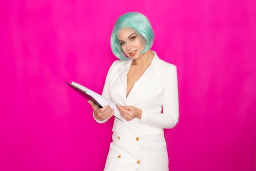 Beautiful young woman with short blue hair in a white business dress jacket holding a black folder with documents