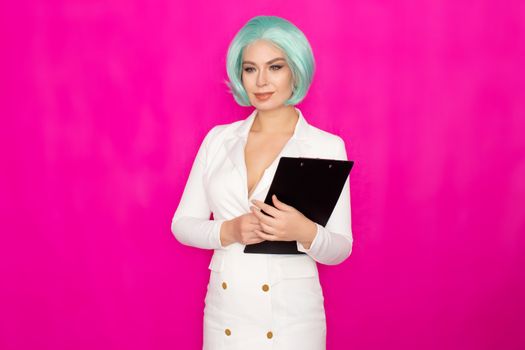 Beautiful young woman with short blue hair in a white business dress jacket holding a black folder with documents