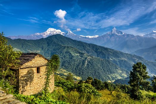 Himalaya mountains and old stone cabin near Pokhara in Nepal