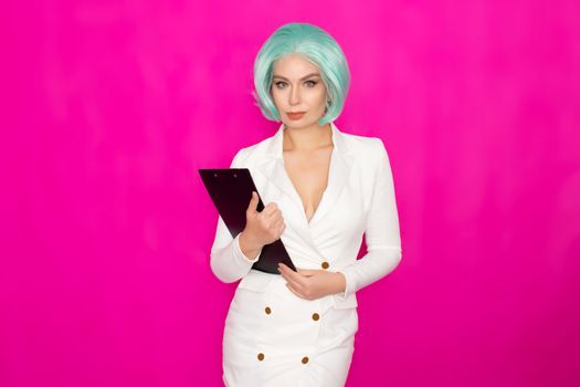 Beautiful young woman with short blue hair in a white business dress jacket holding a black folder with documents