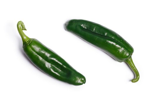 Green Anaheim peppers (Capsicum annuum), the mild variety of New Mexico (Numex) chile No. 9. Clipping paths, shadow separated, top view