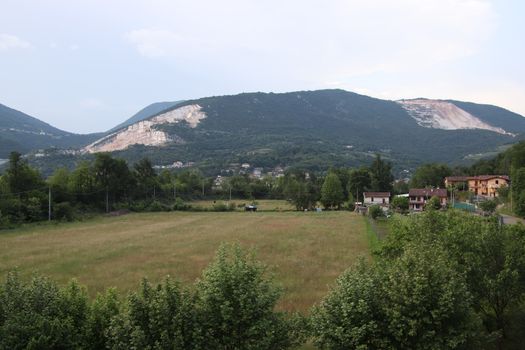 landscape with meadow and mountains in northern Italy