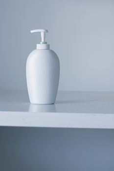 Blank label cosmetic container bottle as product mockup on gray background, hygiene and healthcare