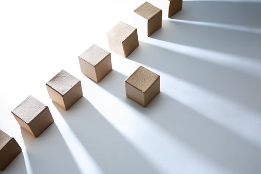 Set of cardboard cubes on white background with shadow