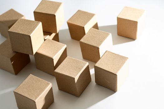 Set of cardboard cubes on white background with shadow