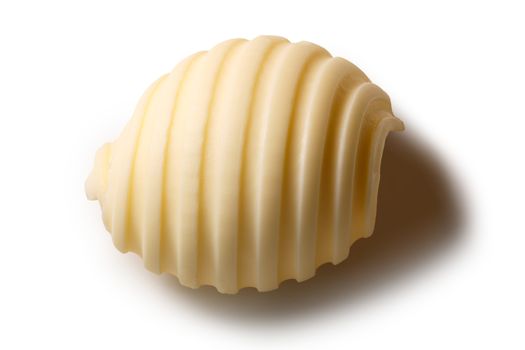 Butter curl or roll, above view. Clipping paths, shadow separated