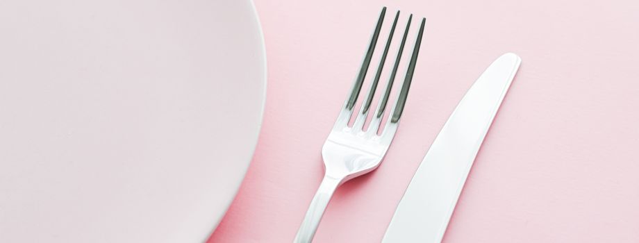 Empty plate and cutlery as mockup set on pink background, top tableware for chef table decor and menu branding design