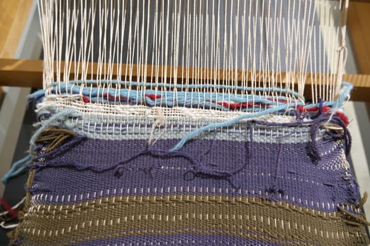 Antique manual loom for the production of fabrics.