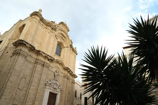 Baroque church in the city of Bari. A small church with a facade made of beige stone. Bari, Puglia, Italy.