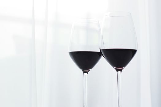 Two crystal glasses of red wine, organic beverage product