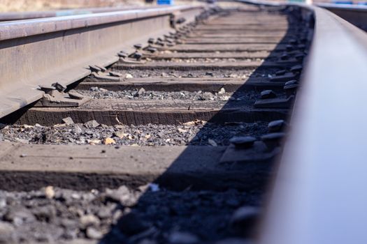 Long rails close-up. Railway. The wooden sleepers.