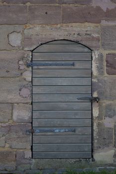 Wooden door in an old wall