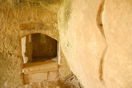 Sassi of Matera with arched ceilings and vaults. Ancient underground house dug out of the tufa rock.