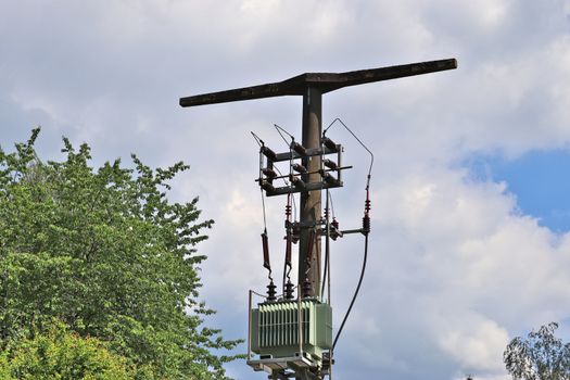 Close up view on a big power pylon transporting electricity in a countryside area in Europe