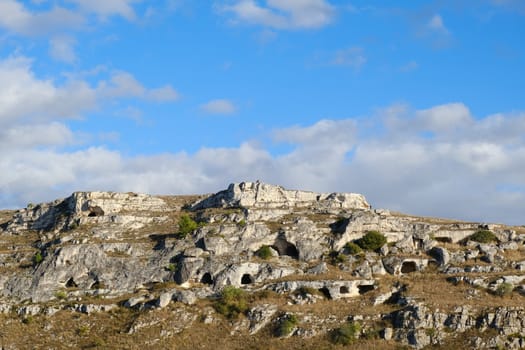 Mountain in front of the city of Matera in Italy. Caves used as dwellings in prehistoric times