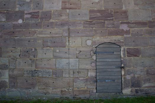 Wooden door in an old wall