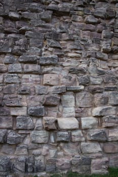 Texture of a stone wall. Old castle stone wall texture background. Stone wall as a background or texture. Part of a stone wall, for background or texture